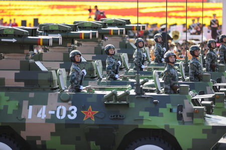 Weapons and equipment are displayed in parade