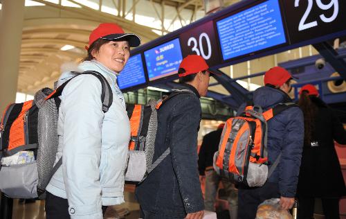 Elite migrant workers on board chartered flights
