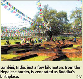 Pilgrims trek path to temple Enlightenment