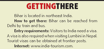 Pilgrims trek path to temple Enlightenment