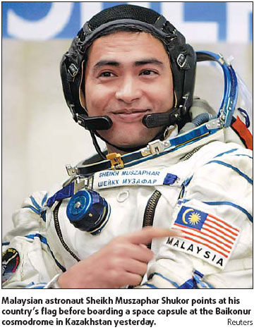 Malaysian astronaut blasts into space