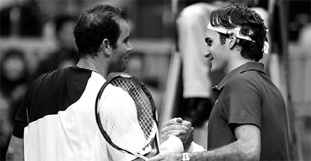 Federer wins clash of titans