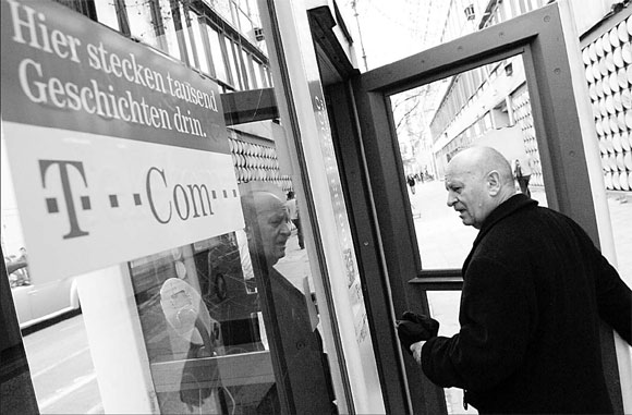 Deutsche Telekom signals more cuts