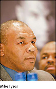 Boxing legend Tyson shows soft side in S. Africa