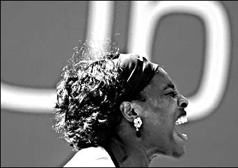 Federer wins, Henin, Williams sisters reach quarters