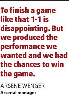 Wenger insists it's not all over yet