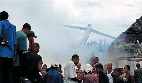 Plane with 85 aboard crashes into crowded area