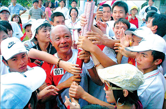 'Farm boy' honored to carry Olympic torch
