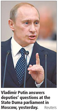 New PM Putin focuses on economy
