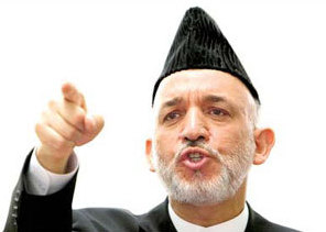 Karzai threatens cross-border strikes