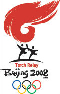 Olympic torch flies to oasis city