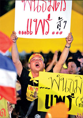 Thai PM defends record, won't quit