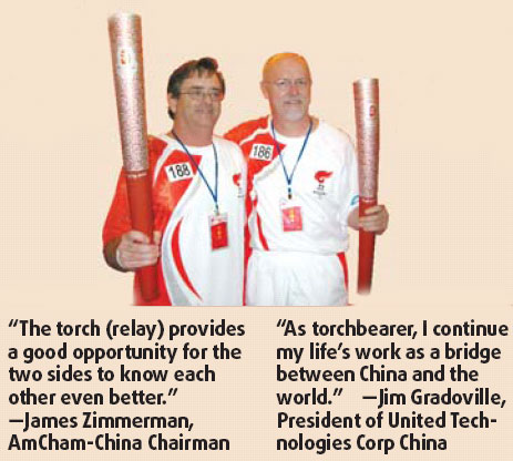 Chamber members carry torch, highlight bonds