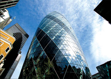 Swiss Re net drops on writedowns