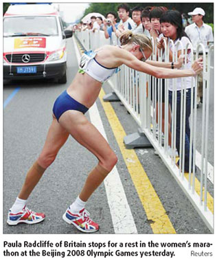 Marathoners battle pain to reach finish line