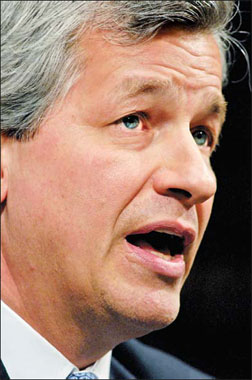 Dimon rises as Wall St tumbles