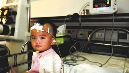 Trying hard to forget a child amid a tainted milk scandal