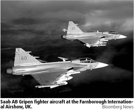 Saab falls on order delays, plans job cuts