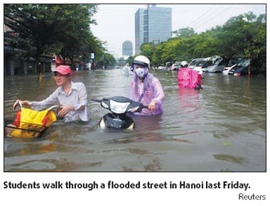 Floods kill 49; Hanoi remains submerged