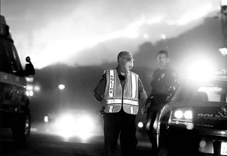 Fires ring LA; thousands flee