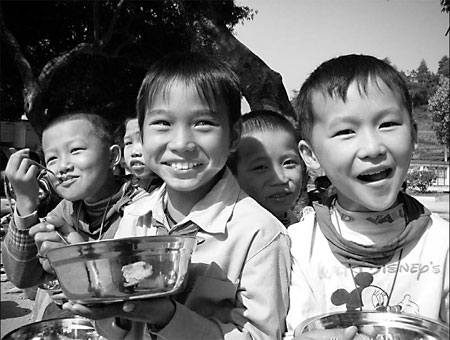 Schoolkids tuck in to free lunches
