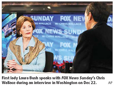 Bush a natural athlete ducking shoe-throwing, says first lady