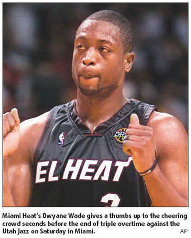 Wade gets 50, Heat refuse to say die in 3 OT win