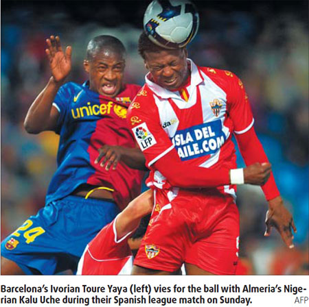 Barca win at Almeria, Sevilla held at Malaga
