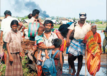 Troops move in on Tigers, 52,000 flee