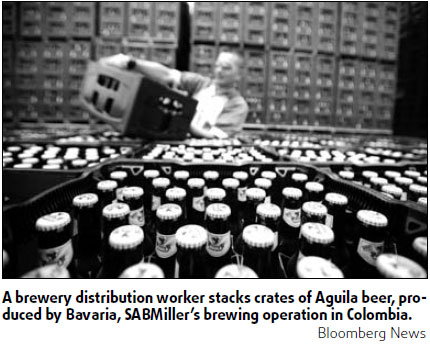 Brewer trims plans after profits drop