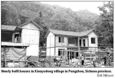 New homes, new hopes rise amid scattered tombstones