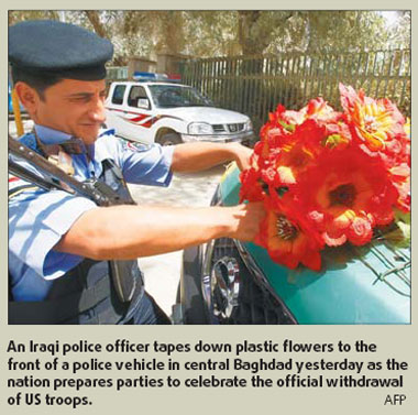 Carnival time for Iraqis as nation waves farewell to 'invaders' after 6-year occupation