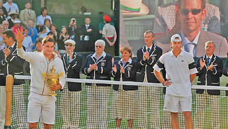 Federer vows to keep breaking records