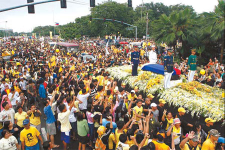 Revered ex-leader Aquino laid to rest