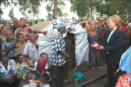 Clinton sets 'tough love' tone on Africa