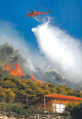 Firemen scramble to tame Greek fires