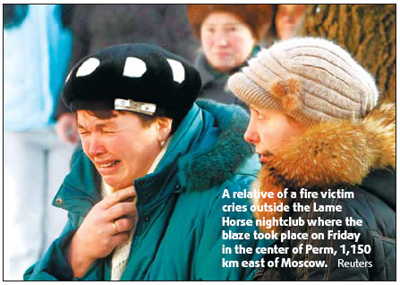 Russians mourn 111 killed in fire