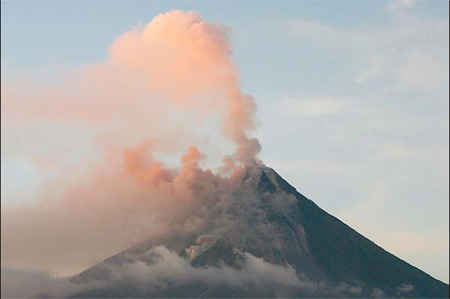 Thousands flee erupting volcano