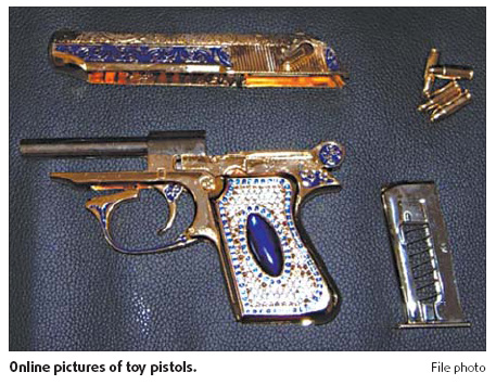 Man sells bejeweled fake pistols online, prompts concern