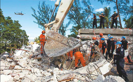 Searchers chasing miracles under rubble