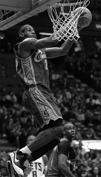 James has double-double as Cavs toy with Nets