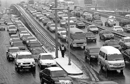 Snow slows traffic on the streets and in the air