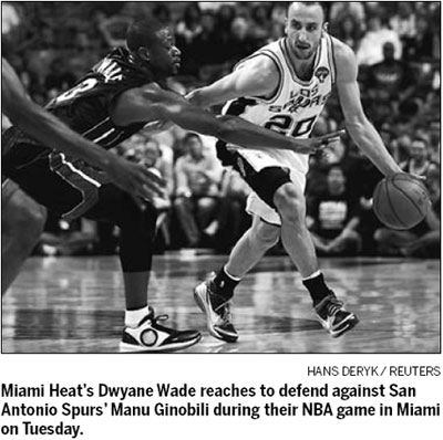 Ginobili gets 22, Spurs hang on to cool off Heat