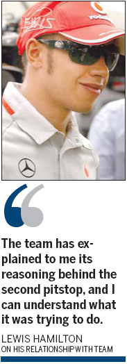 Hamilton hugs Button, makes peace with team