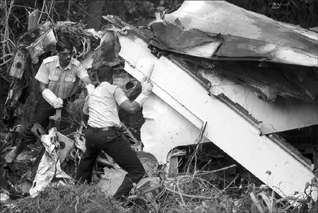 Hunt for clues after India crash kills 158; eight live
