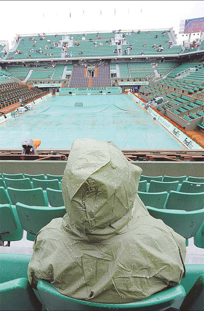 French Open under siege by rain, players