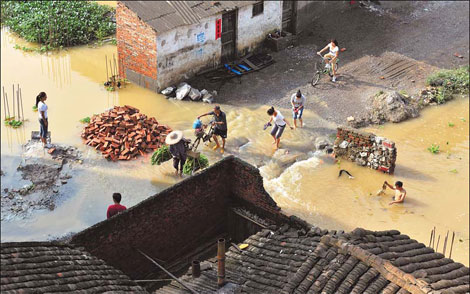 Rains kill at least 51 in Guangxi