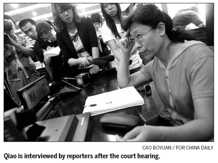 Woman taken hostage in holdup sues bank