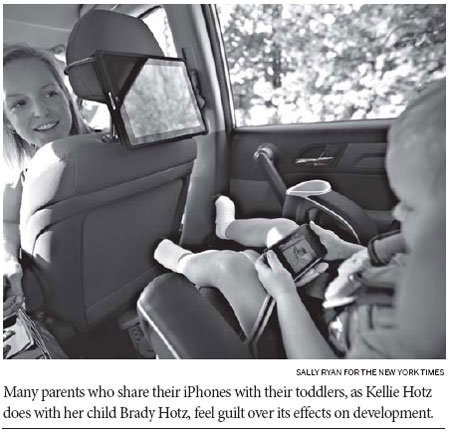 Toddlers vie with parents<BR>for playtime on iPhones