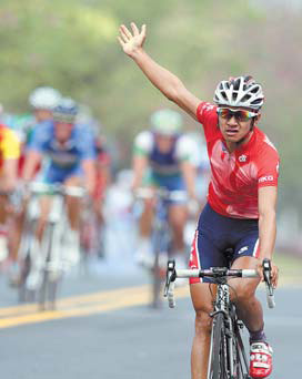 Fortune smiles on Asia's 'god of cycling' as he bags a hat-trick
